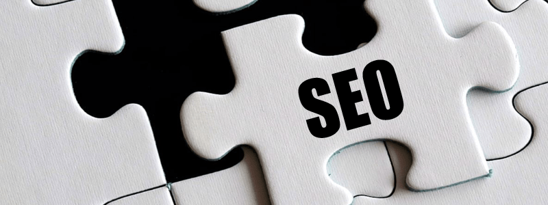 white puzzle piece that says "seo" Siren Media Marketing